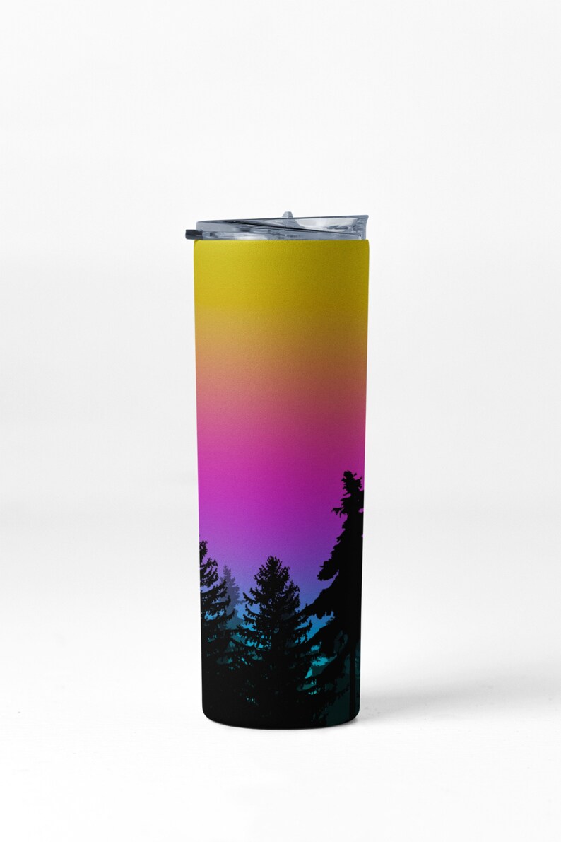 May include: A tall, stainless steel tumbler with a black lid. The tumbler has a gradient design with yellow, orange, pink, blue, and purple colors. The bottom of the tumbler features a silhouette of a forest.