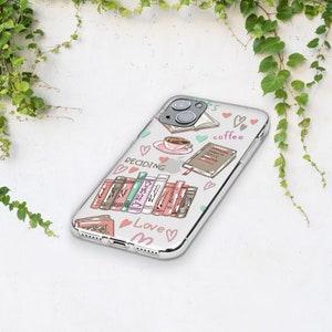 May include: A clear phone case with a colorful design featuring books, coffee cups, hearts, and the words "Reading", "Love", and "Coffee".