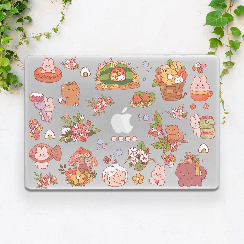 May include: A laptop skin featuring a variety of colourful stickers with cute animals, flowers and other designs. The stickers include a cat, a fish, a mushroom, a watermelon and a flower.
