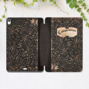 May include: A black and brown composition notebook cover with a worn, vintage look. The cover has a label that says "Composition" in a decorative font.