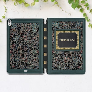May include: A green iPad case with a gold floral pattern and a gold frame around a space for custom text. The text "Custom Text" is displayed in the frame.