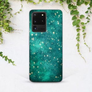 May include: A teal green phone case with a galaxy print and gold glitter stars. The case has a camera cutout with the text "100X" printed on it.