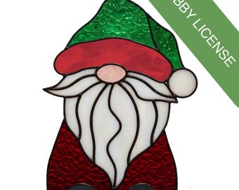 May include: Stained glass gnome with a white beard, red coat, and a green hat. The gnome has a pink nose and a white ball on the hat. The image includes the text "HOBBY LICENSE" in a green banner.