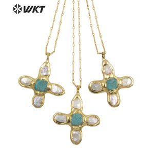 May include: Three gold necklaces with turquoise and white pearl cross pendants. Each pendant features a turquoise stone in the centre surrounded by four white pearl-like stones.