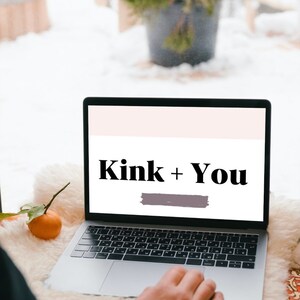 May include: A laptop computer with a white background on the screen. The text "Kink + You" is displayed in black bold font on the screen. A person's hand is resting on the trackpad.
