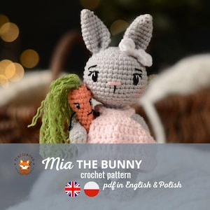 May include: A crochet pattern for a gray bunny named Mia holding a carrot. The pattern is available in English and Polish.