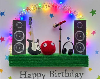 Music lover musician   Light-Up Birthday Card: Mini guitar and speakers, microphone and headphones