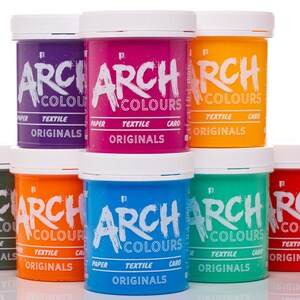 May include: Eight jars of fabric dye in various colors, including purple, pink, orange, green, blue, and red. Each jar has a white lid and a label that reads "ARCH COLOURS ORIGINALS" in black lettering.