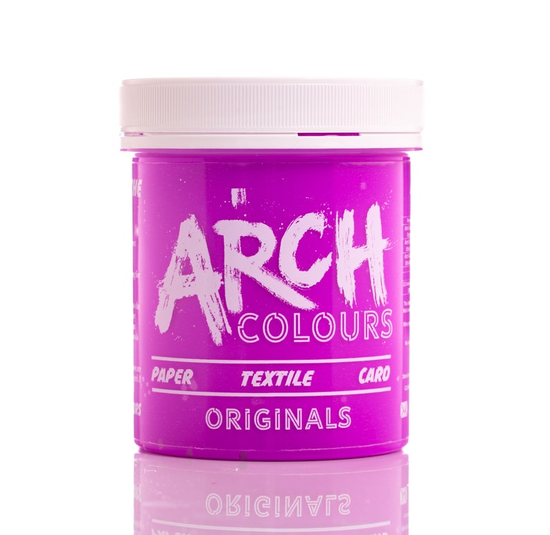 May include: A pink plastic jar of fabric dye with the text "ARCH COLOURS ORIGINALS" on the front. The jar is labeled for use on paper, textile, and card.