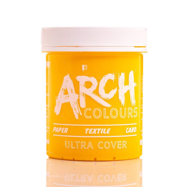 May include: A yellow plastic jar of fabric dye with the text "ARCH COLOURS" and "ULTRA COVER" printed on the label. The jar is labeled for use on paper, textile, and card.