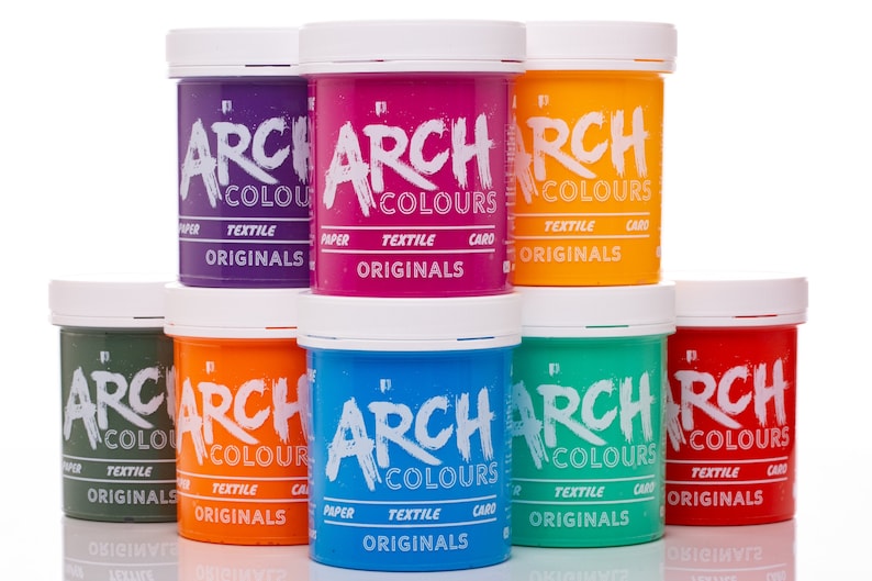 May include: Eight jars of fabric dye in various colors, including purple, pink, orange, green, blue, and red. Each jar has a white lid and a label that reads "ARCH COLOURS ORIGINALS" in black lettering.