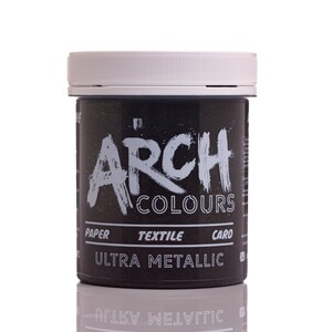 May include: A black jar of paint with a white lid. The jar is labeled "Arch Colours Ultra Metallic" and has the words "Paper, Textile, Card" printed on it.