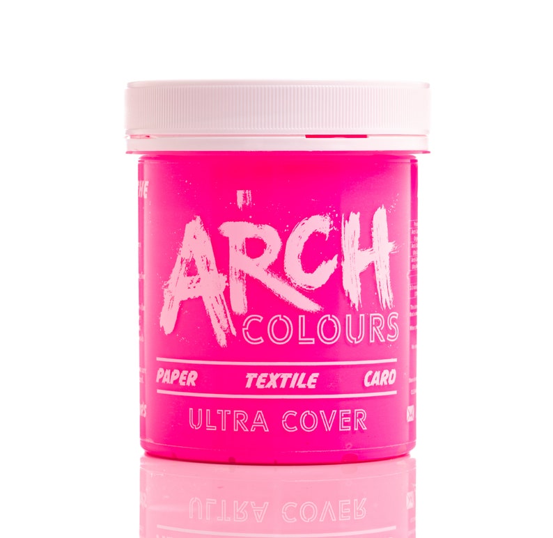 May include: A pink plastic jar of hair dye labeled "ARCH COLOURS ULTRA COVER" with the words "PAPER TEXTILE CARO" printed below the brand name.