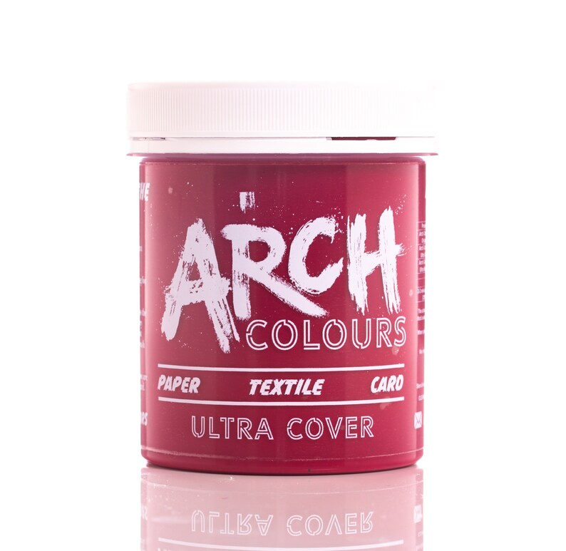 May include: A red plastic jar of Arch Colours Ultra Cover paint for paper, textile, and card. The jar has a white lid and white text.