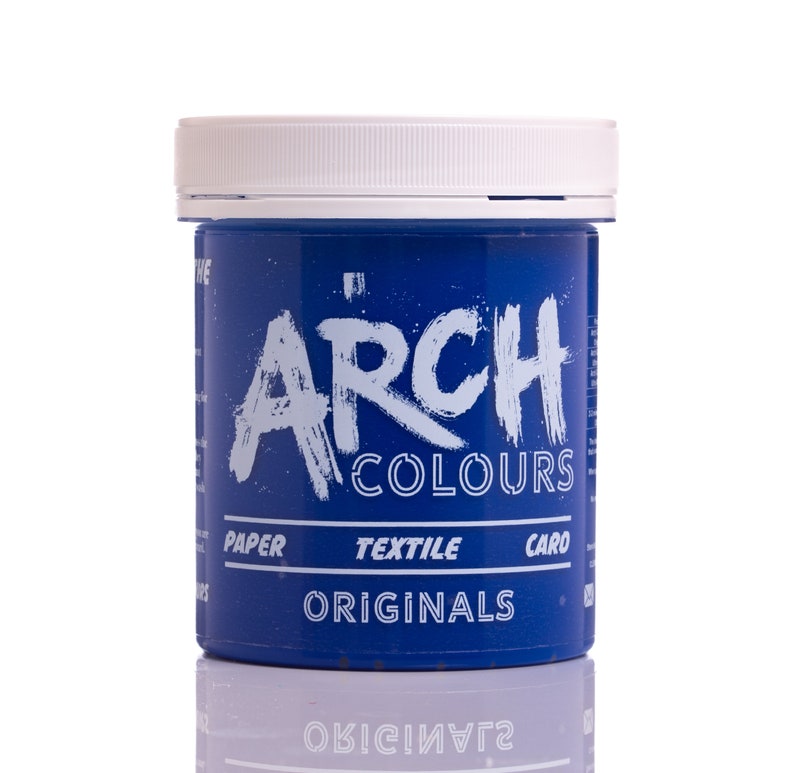May include: A blue plastic jar with a white lid. The jar is labeled "Arch Colours Originals" with the words "Paper, Textile, Card" printed below.