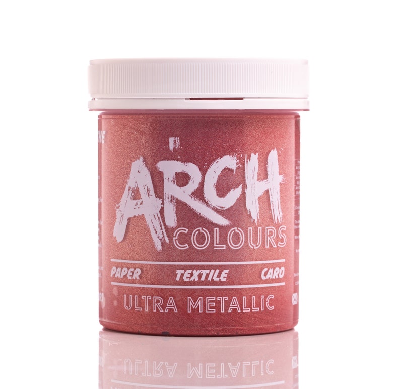 May include: A red metallic paint jar with the text "Arch Colours" and "Ultra Metallic" on the label. The jar is on a white surface.