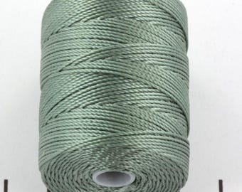 May include: A spool of sage green nylon cord.