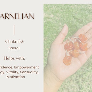 May include: A collection of carnelian stones, a reddish-orange gemstone, wrapped in wire. Carnelian is associated with the sacral chakra and is said to help with confidence, empowerment, energy, vitality, sensuality, and motivation.