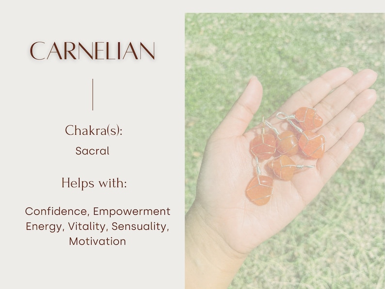 May include: A collection of carnelian stones, a reddish-orange gemstone, wrapped in wire. Carnelian is associated with the sacral chakra and is said to help with confidence, empowerment, energy, vitality, sensuality, and motivation.