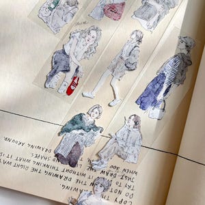 May include: A collection of watercolor-style stickers featuring fashion illustrations of women in various poses and outfits. The stickers are transparent and placed on a beige paper background, with text visible.