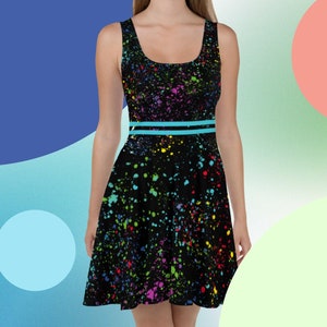 May include: A black skater dress with a colourful paint splatter pattern and a turquoise belt.