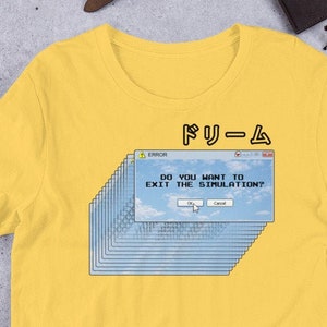 May include: Yellow short-sleeved t-shirt with a blue and white graphic of a computer screen with the text "DO YOU WANT TO EXIT THE SIMULATION?" and the word "DREAM" in Japanese characters.