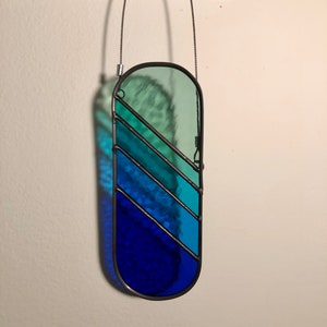 Pill shaped stained glass suncatcher, handmade minimalist window hanging, green