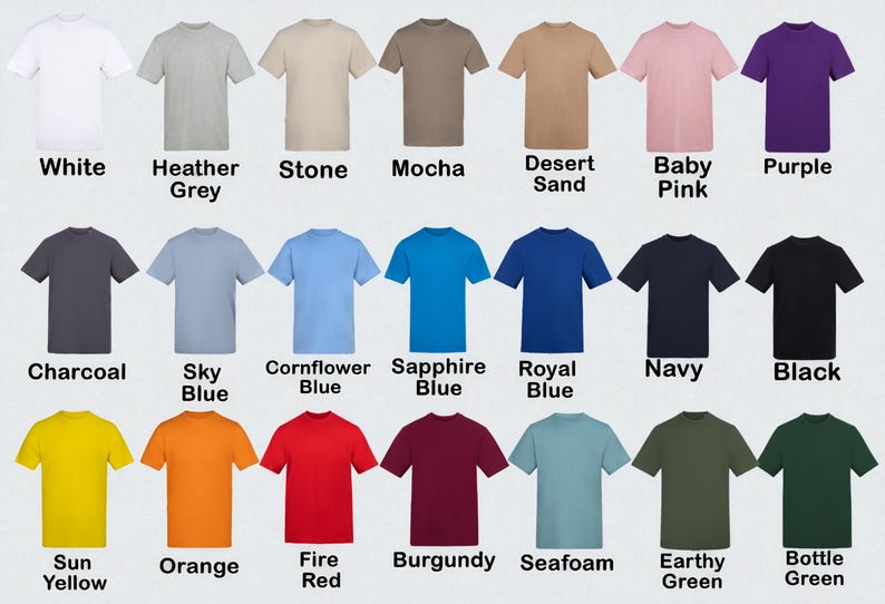 Op de afbeelding: Een verzameling t-shirts met korte mouwen in diverse kleuren, waaronder wit, grijs, beige, bruin, roze, paars, antraciet, blauw, geel, oranje, rood, bordeaux, zeegroen en groen. Elk shirt is voorzien van de kleurnaam.