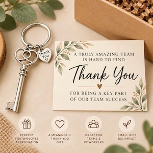 May include: A silver-toned metal key-shaped keychain with a small heart-shaped charm engraved with Thank You and a heart symbol, next to a rectangular card featuring green leaf illustrations and the text A TRULY AMAZING TEAM IS HARD TO FIND Thank You FOR BEING A KEY PART OF OUR TEAM SUCCESS.