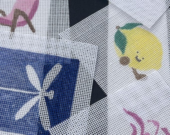 May include: Close-up of several needlepoint canvases with various designs. One canvas features a pink chair, another a lemon with legs, and others have floral and abstract patterns. The background is a mix of black, white, and gray geometric shapes.