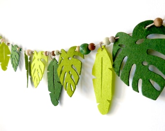Garland jungle wooden beads and monstera and palm leaves in felt