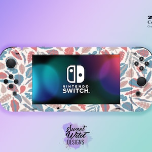 May include: A Nintendo Switch console with a custom skin featuring a repeating pattern of stylized leaves in shades of red, blue, and beige. The console's screen displays the Nintendo Switch logo. The image also includes the text "Sweet Wild Designs."