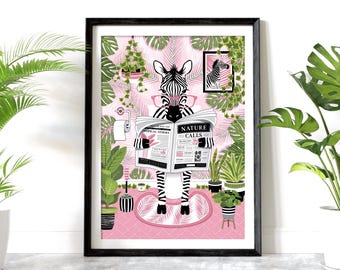 May include: A framed wall art print featuring a zebra wearing pink glasses, sitting on a toilet and reading a newspaper titled Nature Calls. The background is a pink wall with green tropical leaves, potted plants, and a toilet paper roll holder.