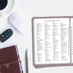 May include: A spiral-bound planner featuring a page titled Detailed Therapy Interventions with an alphabetical list of clinical actions. The planner has a grey cover and is positioned next to a white computer mouse, a car key fob, and a silver pen.