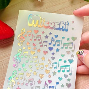 Pegatinas holográficas de notas musicales: calcomanías impermeables para planificadores y álbumes de recortes.