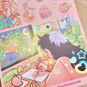 May include: A sheet of stickers with a pink and peach color scheme. The stickers feature illustrations of peaches, desserts, and a person drawing. Holographic star and heart stickers are scattered across the sheet. The text "MICASHI.COM" and "@MICASHI.STORE" are visible.