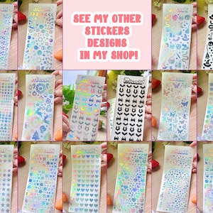 May include: A collection of holographic stickers with various designs, including stars, hearts, and bats. The stickers are on clear backing sheets. Text on the stickers reads "Mitoshi". The image also includes the text "SEE MY OTHER STICKERS DESIGNS IN MY SHOP!"