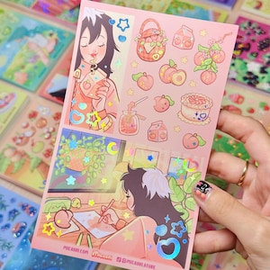 May include: A sheet of stickers with a peach theme. The stickers feature illustrations of peaches, peach desserts, and a person drinking peach juice. The sheet also includes the text "micashi.com" and "@micashistore".