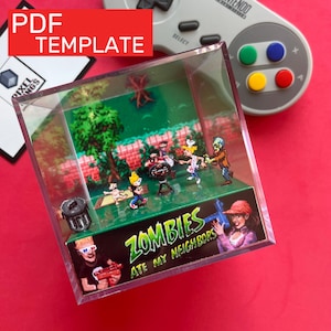 Pode incluir: Um diorama em miniatura numa caixa transparente com figuras pixelizadas do videojogo "Zombies Ate My Neighbors". A cena inclui zombies, crianças e uma churrasqueira. A caixa tem o texto "PDF TEMPLATE" e "ZOMBIES ATE MY NEIGHBORS."