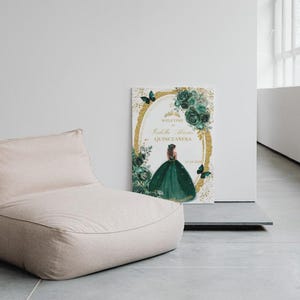 May include: A welcome sign for a Quincea&ntilde;era with a gold and green color scheme. The sign features a silhouette of a girl in a green dress with a gold crown and butterflies. The text on the sign reads "Welcome to [Name]'s Quincea&ntilde;era".