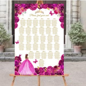May include: A seating chart with a pink and gold floral design. The chart features a crown and the text "Please, find your seat." A young woman in a pink gown is at the bottom. The chart is displayed on a wooden easel.