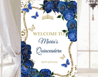 May include: Welcome to Maria's Quinceañera sign with blue roses, gold glitter, and butterflies. The date April 15th 2023 is printed below the text.