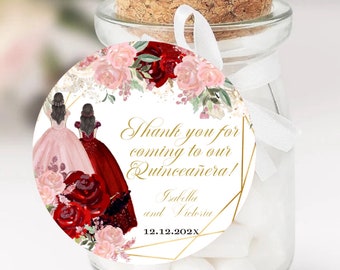 May include: A glass jar with a cork stopper and a white ribbon, filled with white candies. A round tag with a floral design and the text "Thank you for coming to our Quinceañera!" is attached.