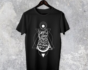 May include: Black t-shirt with a white geometric design featuring a cat sitting inside a triangle with a circle around it.
