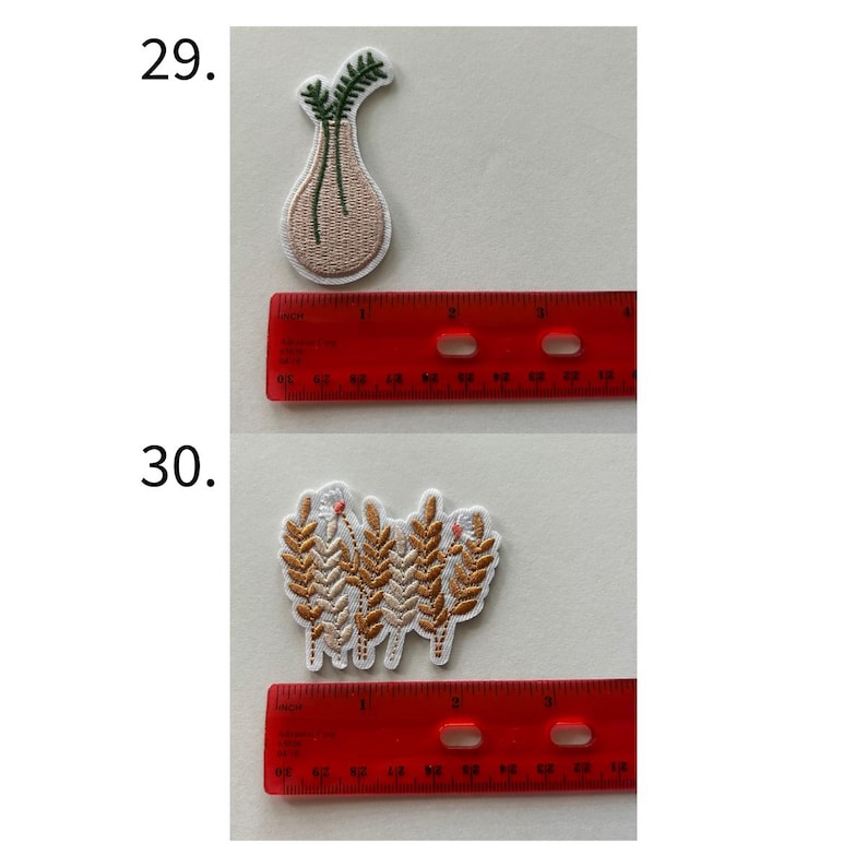 May include: Two embroidered patches. The top patch is a beige vase shape with green leaves. The bottom patch is a cluster of wheat stalks in shades of brown and white. A red ruler is next to each patch.