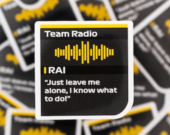 May include: A sticker with the text "Team Radio" and a yellow sound wave graphic. Below the graphic is the text "IRAI" and a quote: "Just leave me alone, I know what to do!" The sticker is black with yellow and white accents.