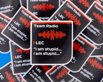 May include: A collection of square stickers with a black background and red and white text. The stickers read "Team Radio" and "LEC" with the phrase "I am stupid..." repeated. A red sound wave graphic is also present.