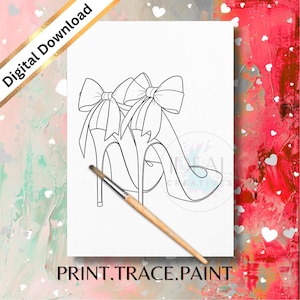 May include: Black and white line art of high-heeled shoes with large bows, labeled "Digital Download". A paintbrush rests on the paper, with the text "PRINT.TRACE.PAINT" at the bottom. The background is a mix of pink and red.