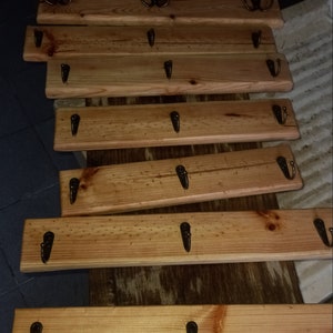 Claimed wooden clothes rack and rustic metal hooks