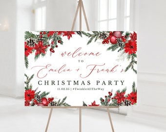 May include: A white sign on a wooden easel with a Christmas theme. The sign reads "welcome to Emilia + Frank's CHRISTMAS PARTY" in red script. The sign is decorated with red poinsettias, pinecones, and greenery.